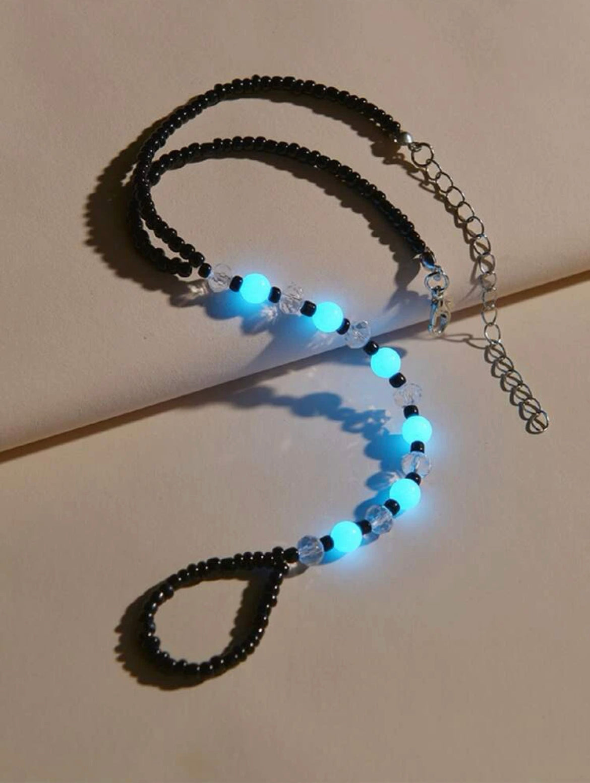 Glow in the dark beaded anklet. Black