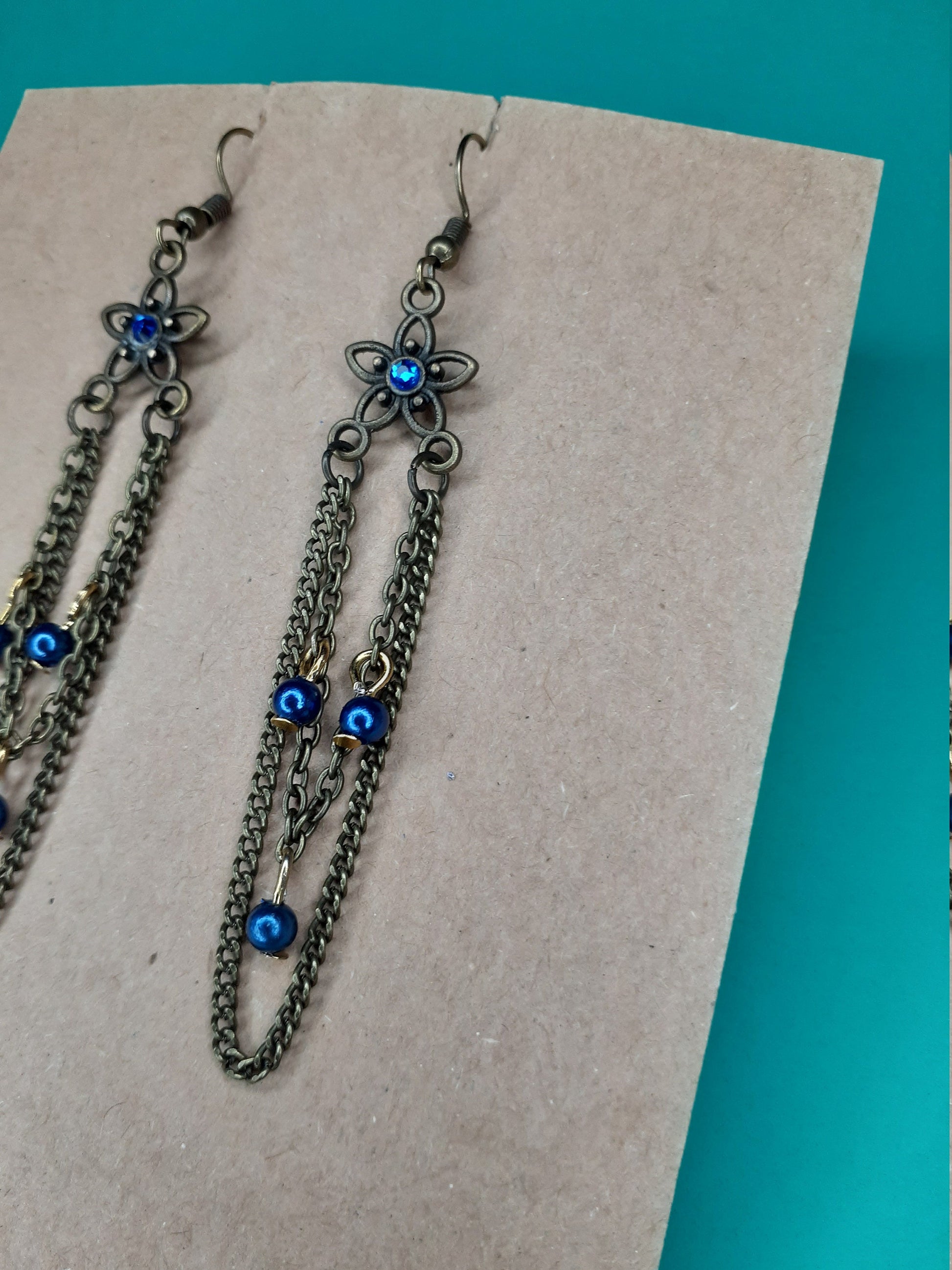 Vintage inspired earrings. Blue accents on bronze.