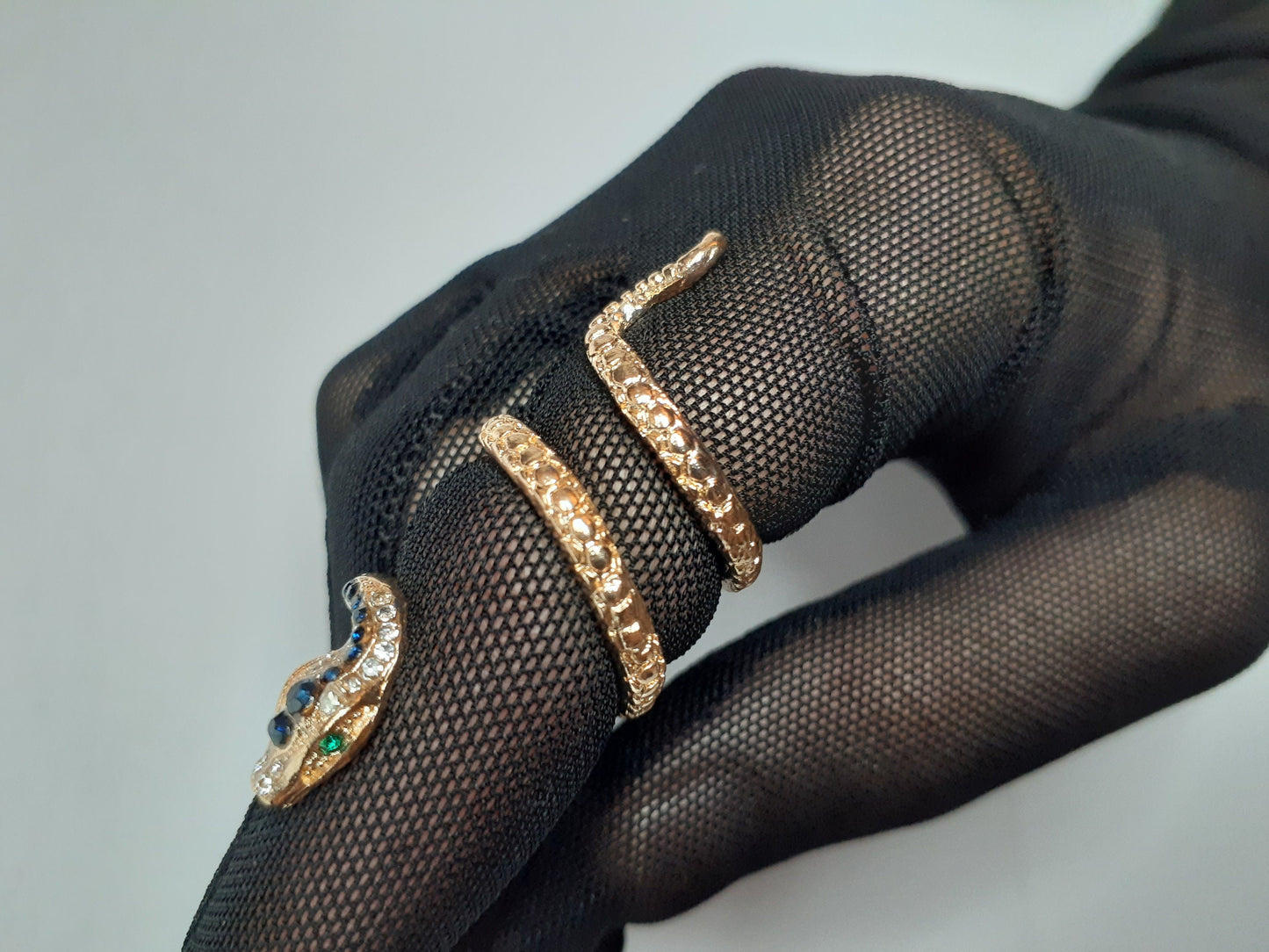 Adjustable gold snake ring with rhinestone details