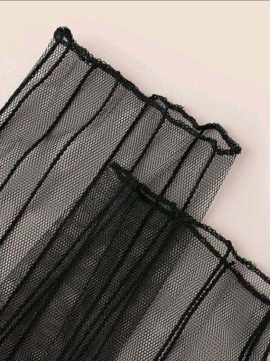 Close up of embroidered mesh arm sleeves