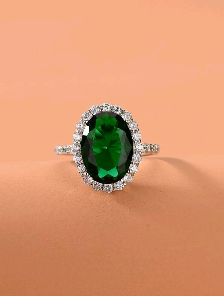 Emerald ring with zircon