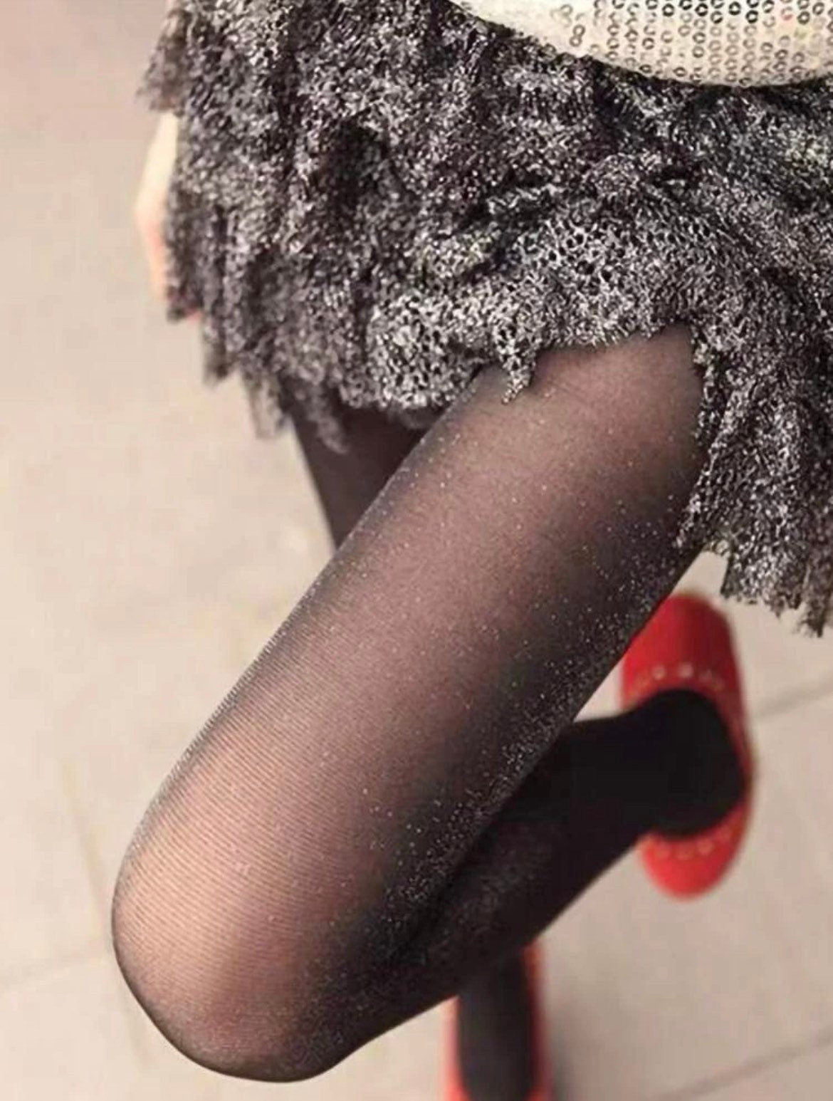 Sheer black pantyhose with glitter