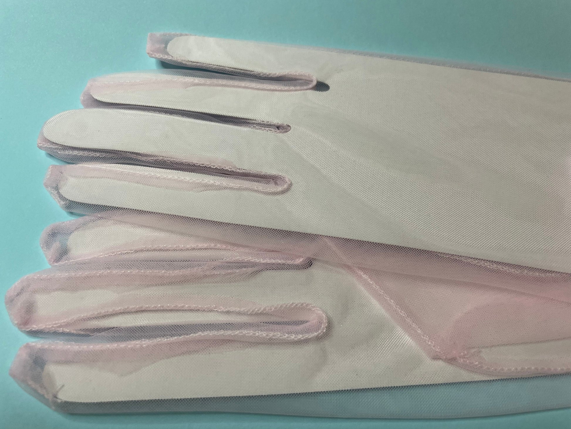 Light pink sheer gloves