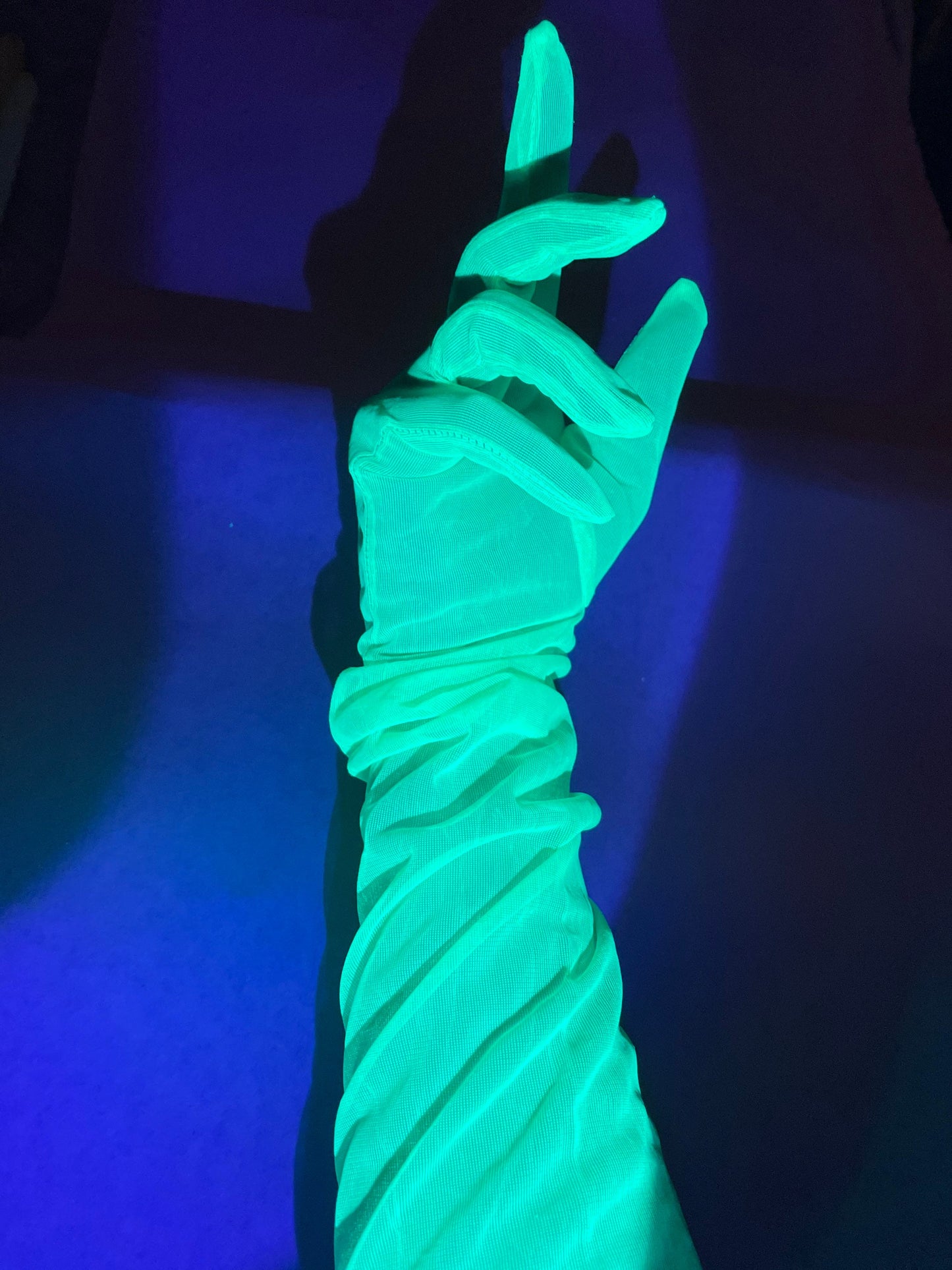Neon green UV reactive glow in the dark fluorescent gloves.