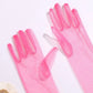 Sheer pink material. Bright pink long gloves.