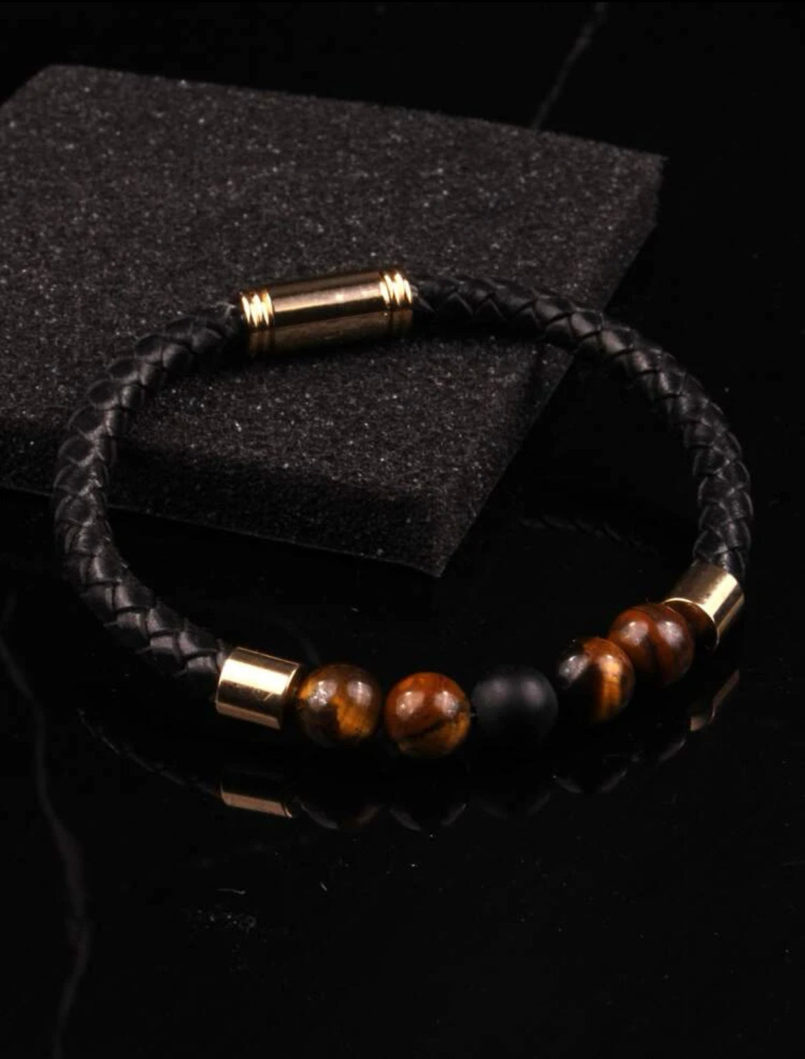 Black woven mens bracelet with magnetic closure.